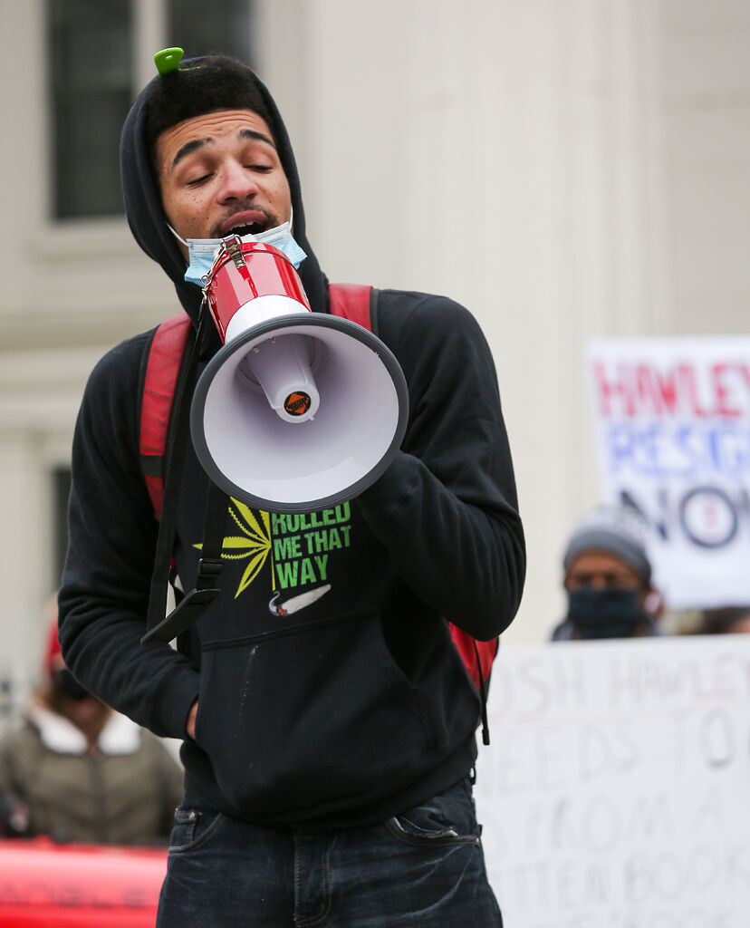Elijah Foggy, 19, from St. Louis, addresses the crowd gathered during the Resign Hawley rally